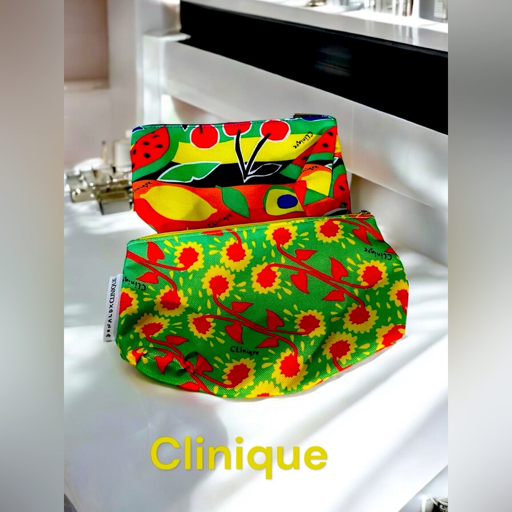 Clinique lot of 2 cosmetics bags 1 fruit theme 1 floral theme 9 by 5.5 inches